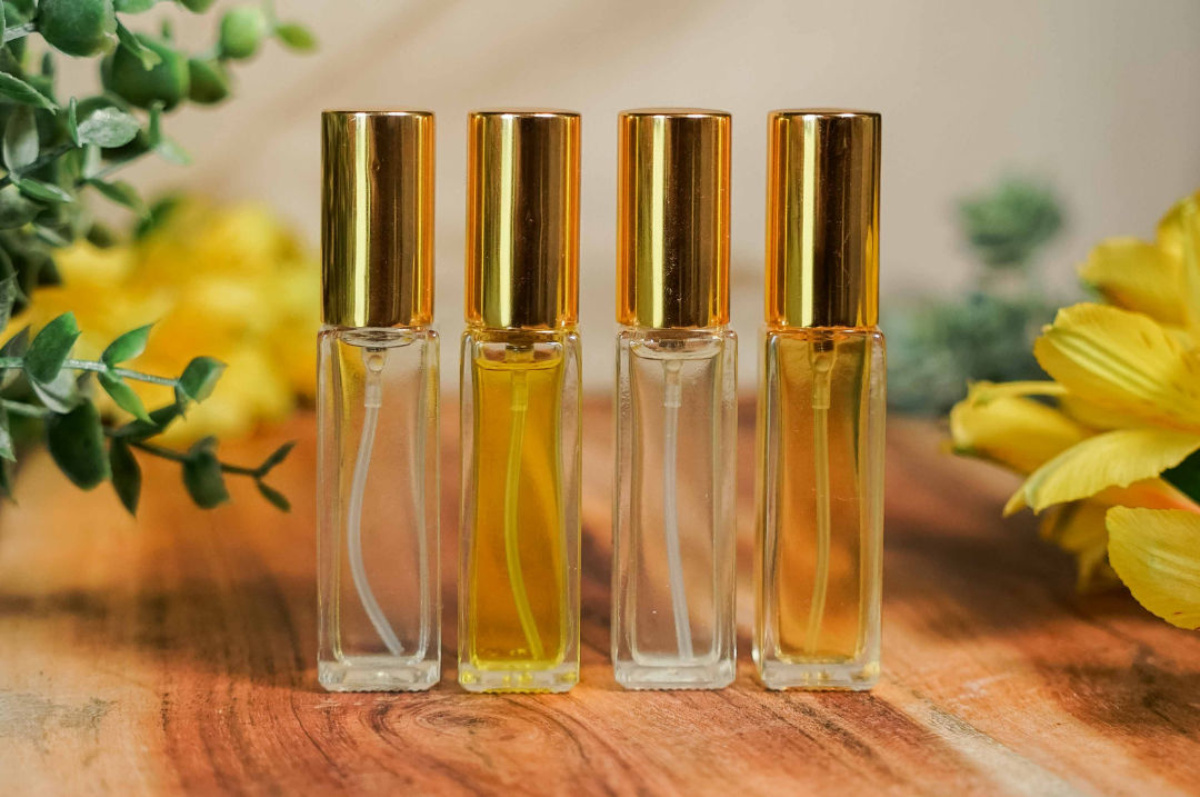 Guest blending a custom perfume with essential oils