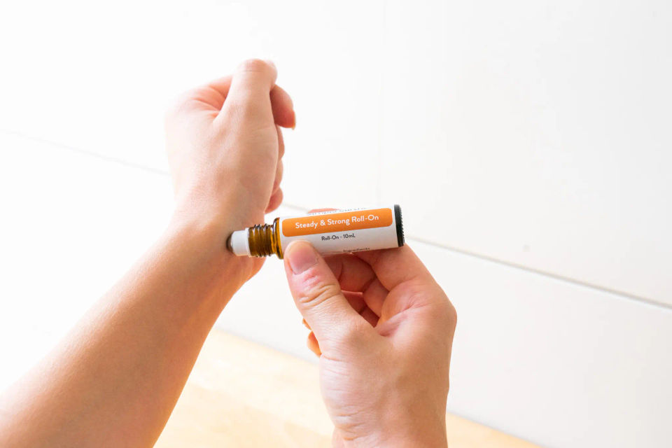 A Steady & Strong roll-on rolled across a wrist